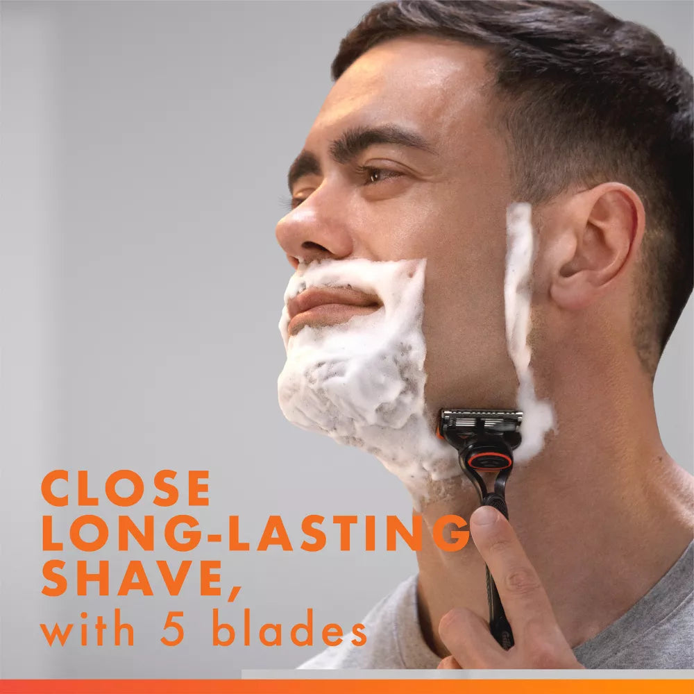 Man shaving with a five-blade cartridge razor