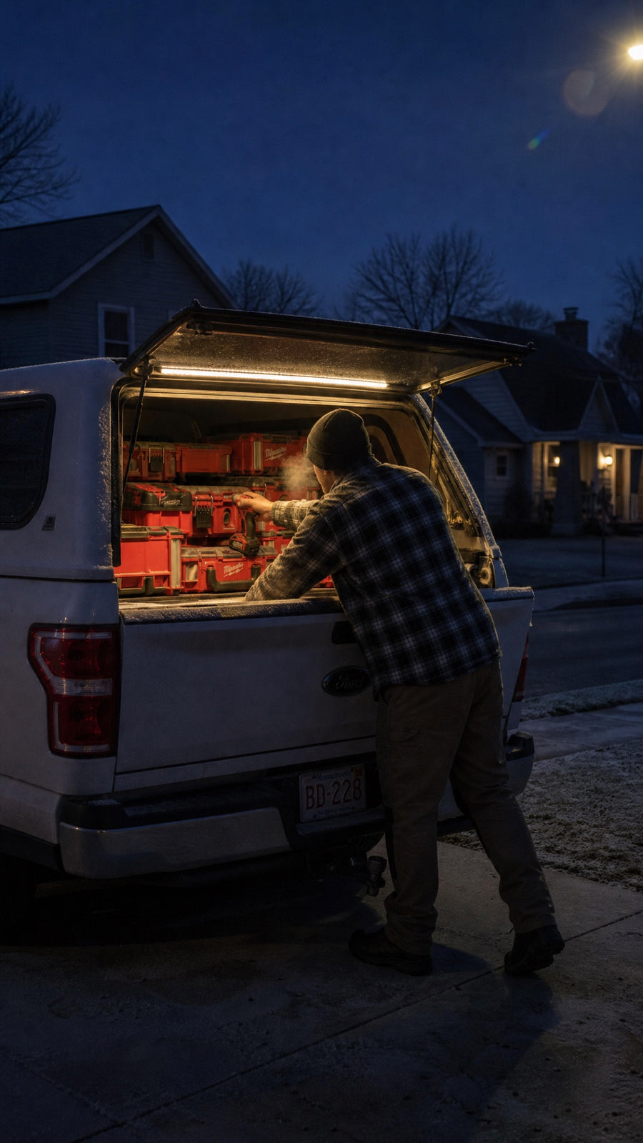 Pre-dawn driveway, lit truck cap