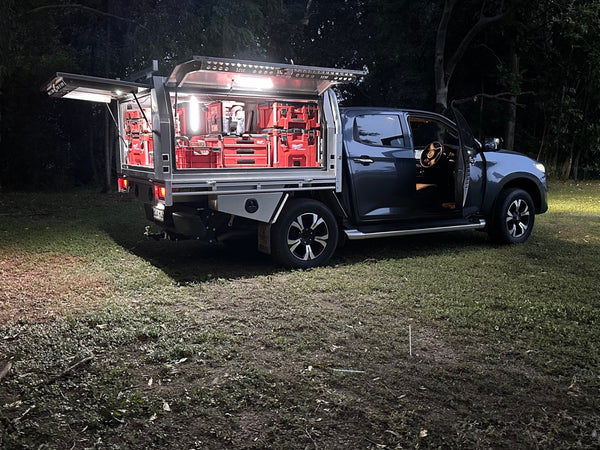 Pickup with its truck cap lit by a Lumo-300