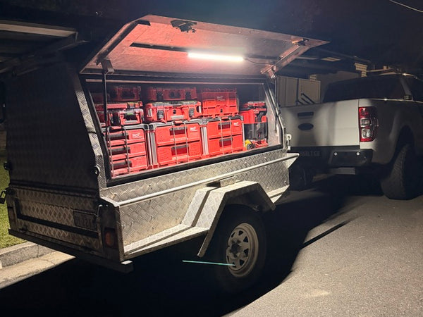 Tool box on a truck bed lit up by a Lumo-300 at night